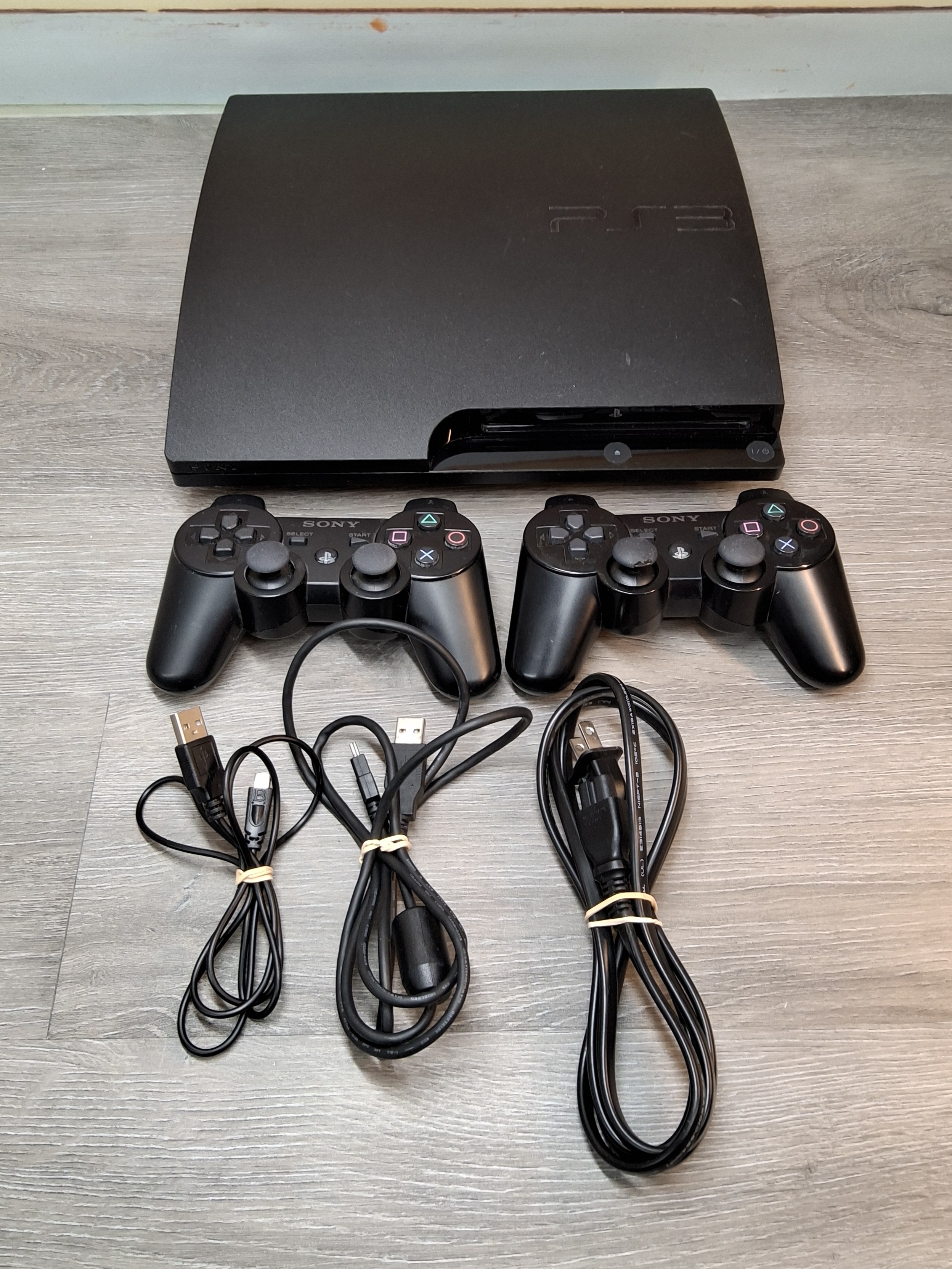 Sony PlayStation 3 Slim Console Bundle with 2 Controllers (pick up only)